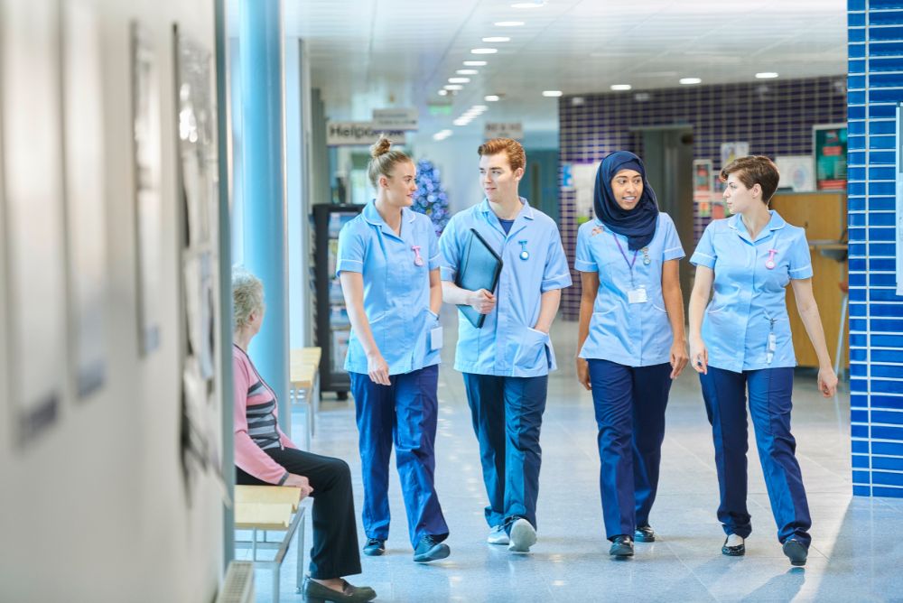 nurses walking through the hospital corridor